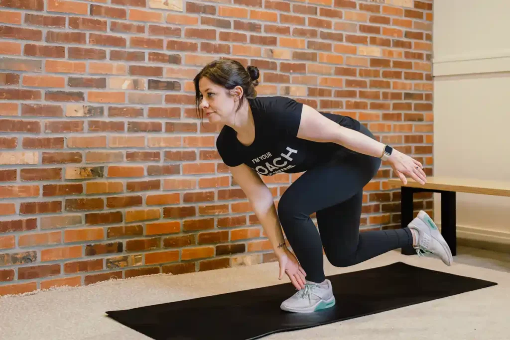 A person exercising their arms at home with light weights Horsham