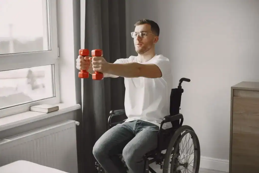 Image of man doing exercise in his wheelchair to aid weight loss Horsham