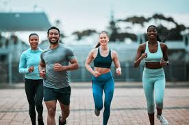 image of people running to incorporate cardio Horsham exercise into their life to help tone arms and body.